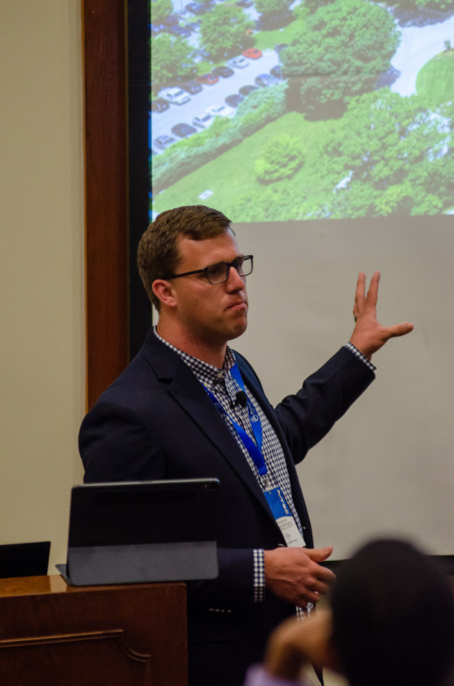 A presenter explaining his slideshow